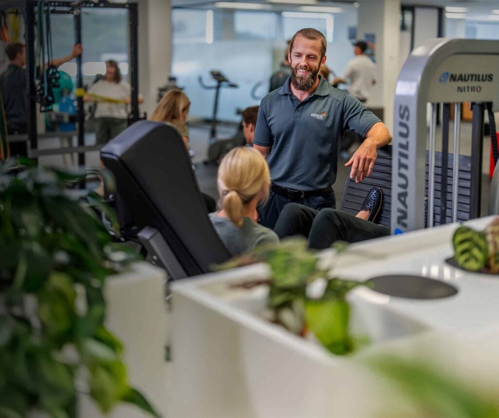 A ethos health physiotherapist working with a client