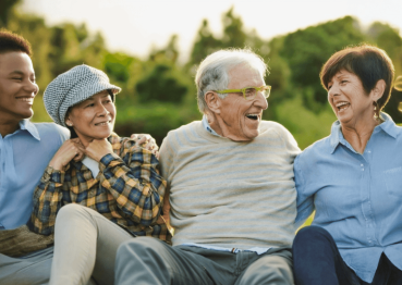 Friendly group of diverse older adults enjoying outdoor wellness visit at Ethos Health.