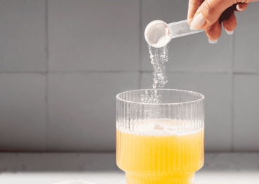 collagen supplement powder in glass of water